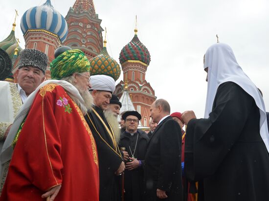 President Vladimir Putin lays flowers at Minin and Pozharsky monument on Red Square