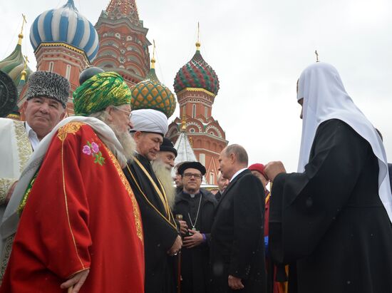 President Vladimir Putin lays flowers at Minin and Pozharsky monument on Red Square