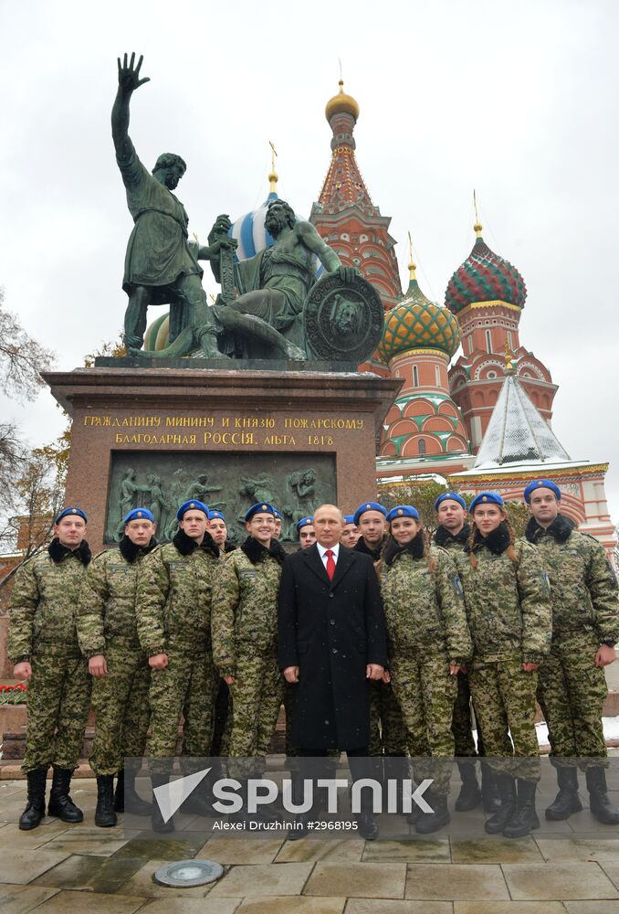 President Vladimir Putin lays flowers at Minin and Pozharsky monument on Red Square