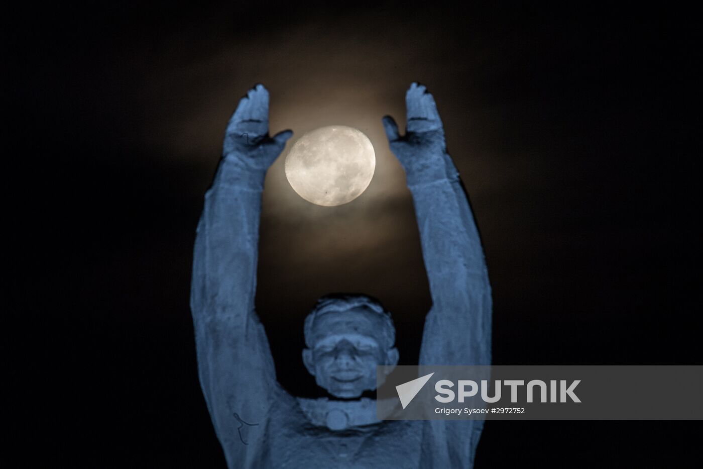 Moon against Yury Gagarin monument in Baikonur