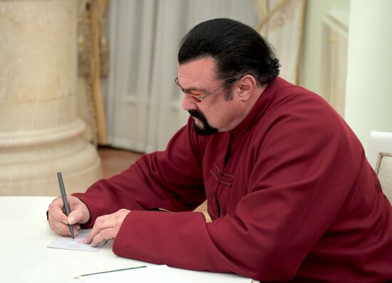 President Vladimir Putin meets with US actor Steven Seagal