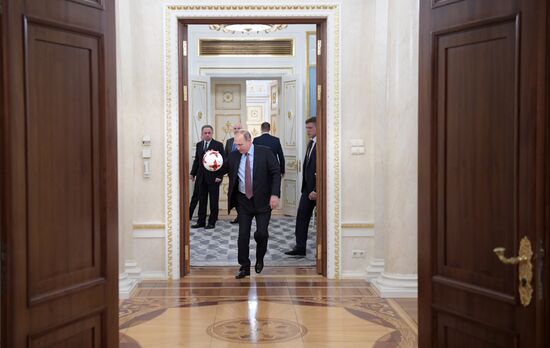 President Vladimir Putin meets with FIFA President Gianni Infantino