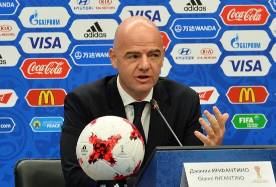 Gianni Infantino speaks with journalists before draft procedure of 2017 FIFA Confederations Cup