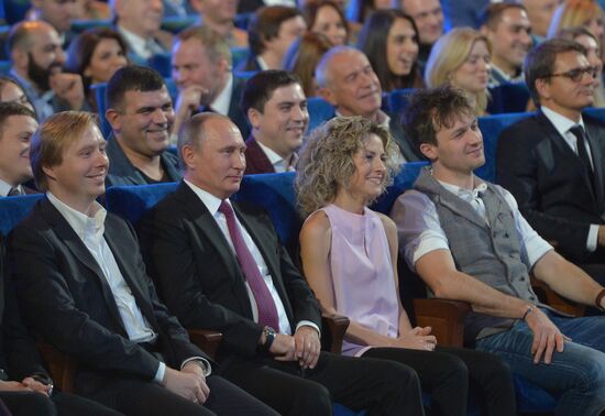 Vladimir Putin at anniversary KVN humor TV game show in Moscow