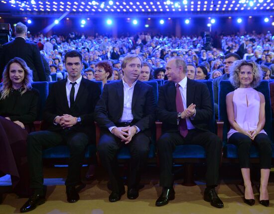 Vladimir Putin at anniversary KVN humor TV game show in Moscow