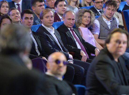 Vladimir Putin at anniversary KVN humor TV game show in Moscow