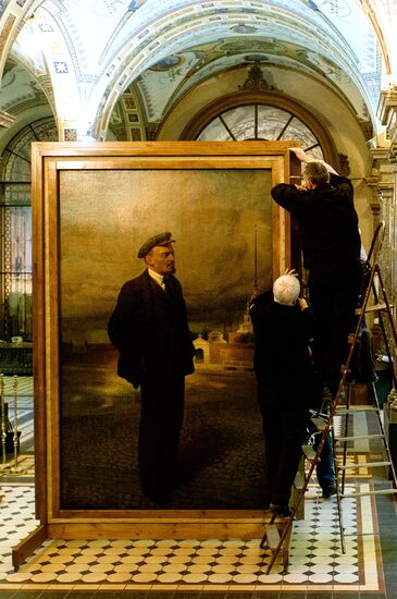 Preparing restored double-sided painting with portraits of Emperor Nicholas II and Vladimir Lenin for presentation at Stieglitz Academy