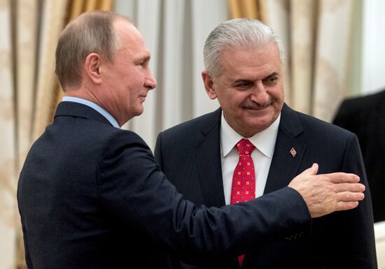Russian President Vladimir Putin meets with Turkish Prime Minister Binali Yildirim