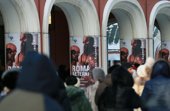 People stand in queue to buy Vatican Pinacotheca exhibition tickets