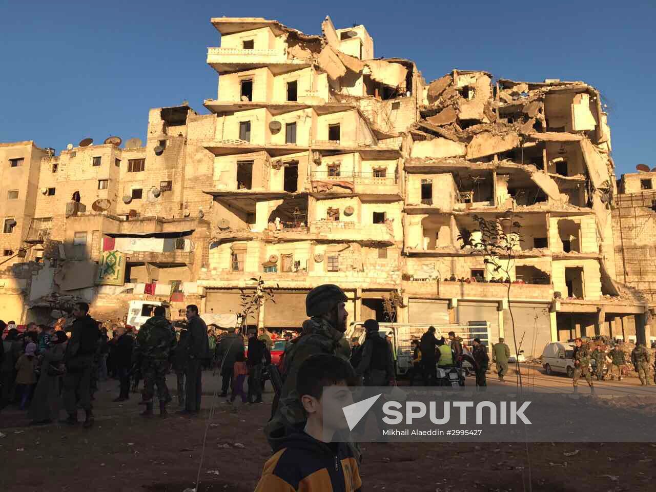 Aleppo residents after militants and their families leave eastern Aleppo