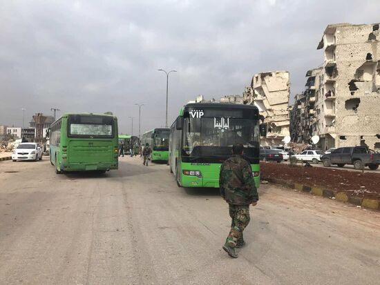 Militants and their families leave eastern Aleppo
