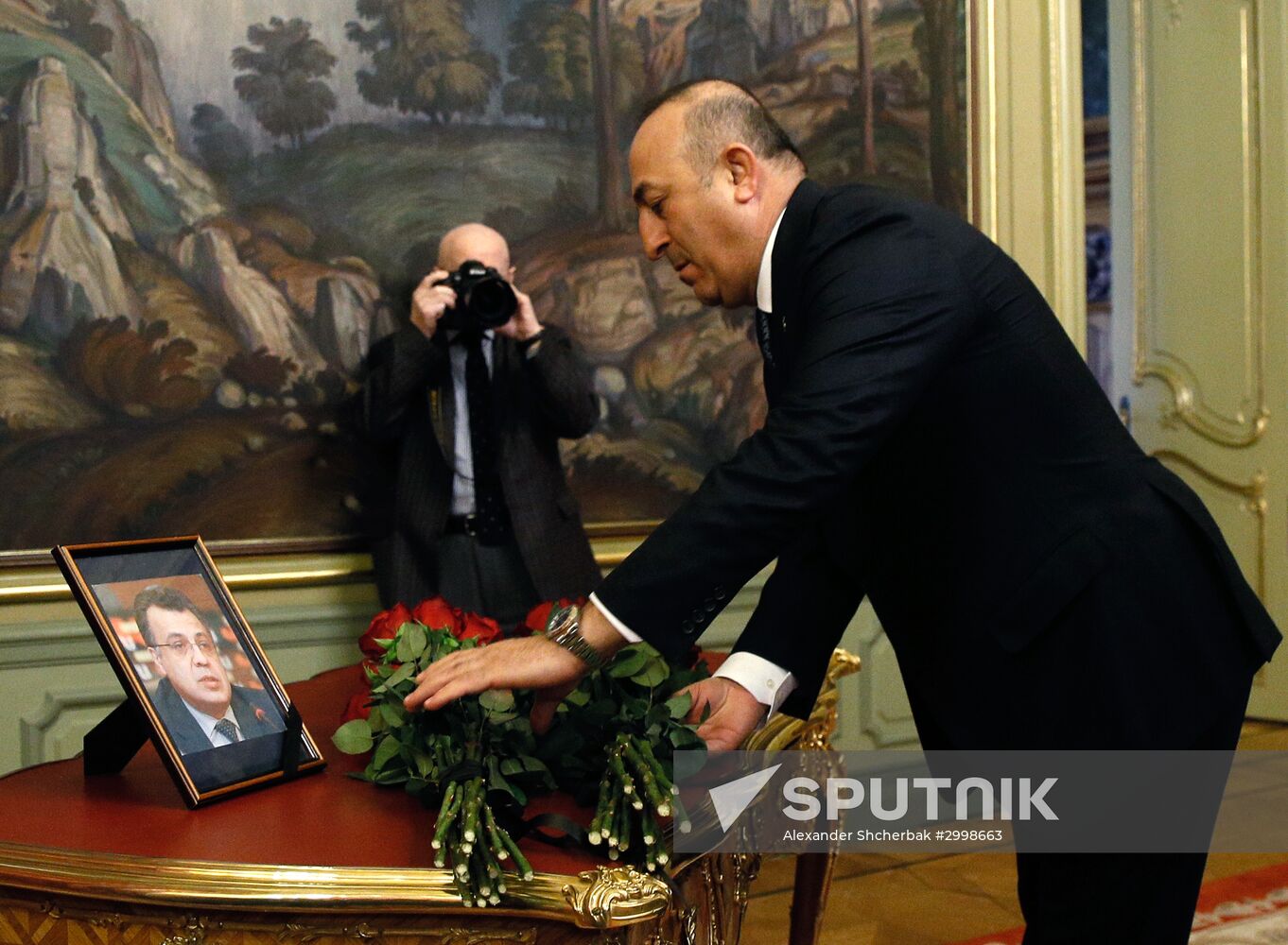 Russian, Iranian, Turkish Foreign Ministers lay flowers in memory of slain Ambassador Andrei Karlov