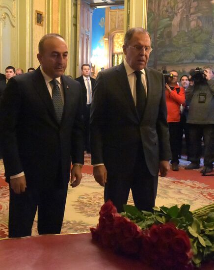 Foreign ministers of Russia, Iran, Turkey lay flowers in memory of Ambassador Andrei Karlov