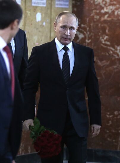 President Vladimir Putin and Prime Minister Dmitry Medvedev pay their last respects to Russian Ambassador to Turkey Andrei Karlov