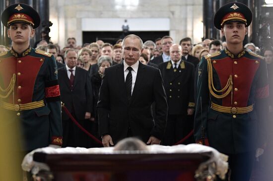 President Vladimir Putin and Prime Minister Dmitry Medvedev pay their last respects to Russian Ambassador to Turkey Andrei Karlov
