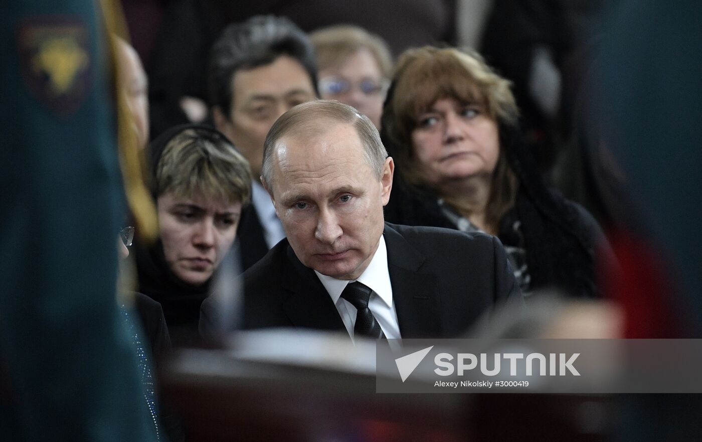 President Vladimir Putin and Prime Minister Dmitry Medvedev pay their last respects to Russian Ambassador to Turkey Andrei Karlov