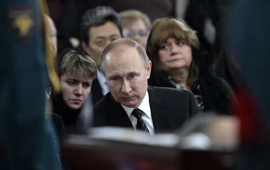 President Vladimir Putin and Prime Minister Dmitry Medvedev pay their last respects to Russian Ambassador to Turkey Andrei Karlov