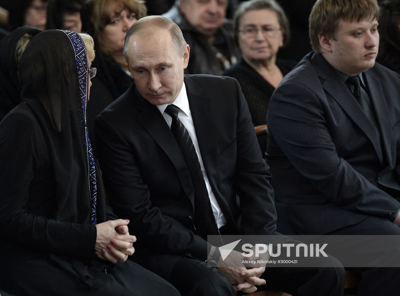 President Vladimir Putin and Prime Minister Dmitry Medvedev pay their last respects to Russian Ambassador to Turkey Andrei Karlov