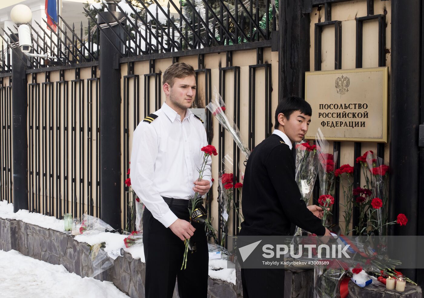 Flowers at Russian embassy in Kyrgyzstan honoring victims of Tu-154 crash in Sochi