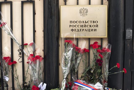 Flowers at Russian embassy in Kyrgyzstan honoring victims of Tu-154 crash in Sochi