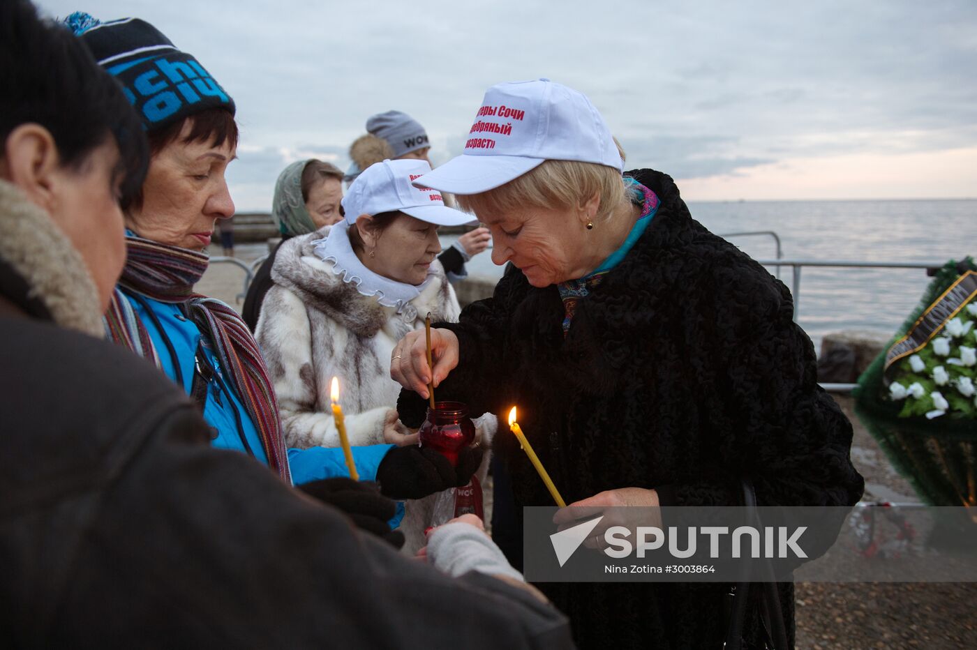 Sochi residents bring flowers, candles to South Pier Square