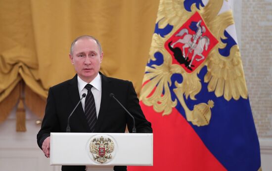 President Vladimir Putin addresses New Year reception at the Kremlin