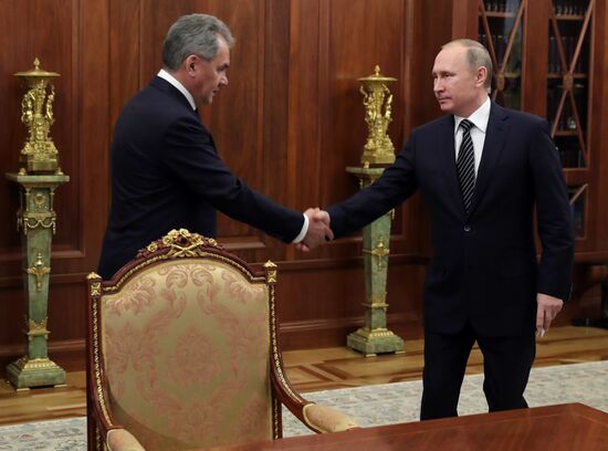Russian President Vladimir Putin meets with Defense Minister Sergei Shoigu and Foreign Minister Sergei Lavrov