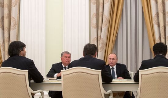 President Vladimir Putin meets with representatives of foreign business circles