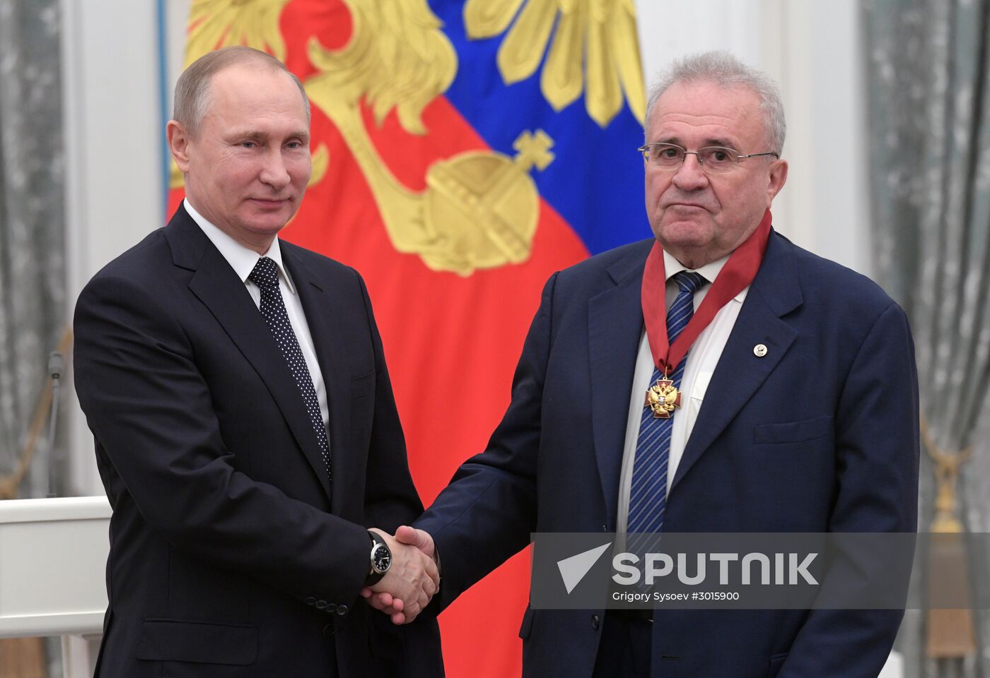 Russian President Vladimir Putin presents state decorations