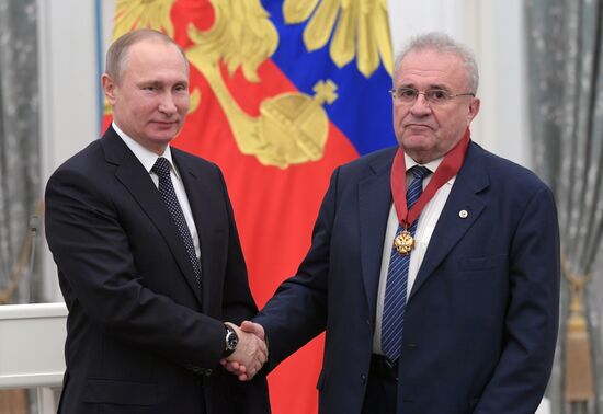 Russian President Vladimir Putin presents state decorations