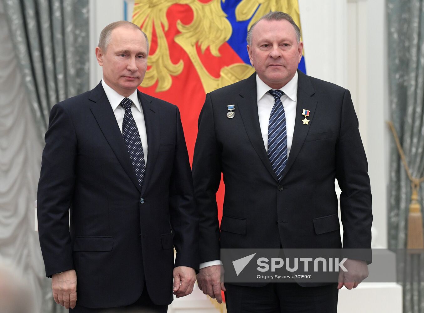 Russian President Vladimir Putin presents state decorations