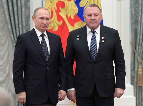 Russian President Vladimir Putin presents state decorations