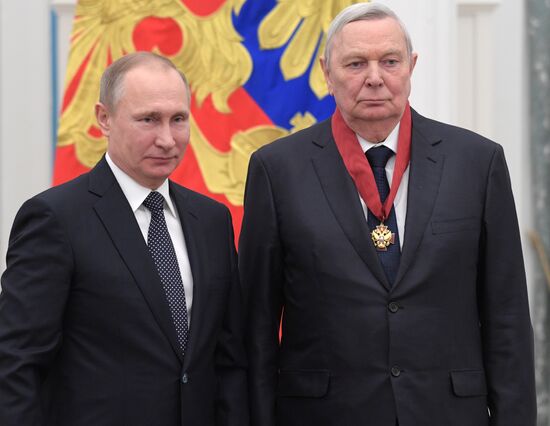 Russian President Vladimir Putin presents state decorations