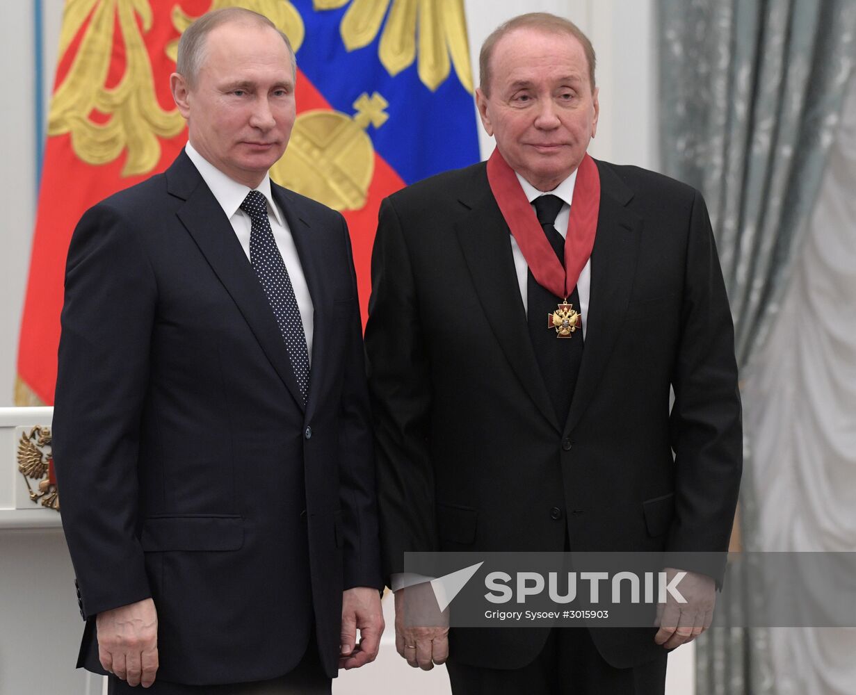 Russian President Vladimir Putin presents state decorations