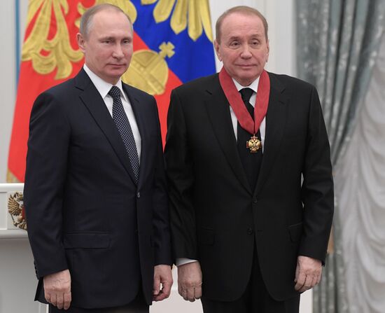 Russian President Vladimir Putin presents state decorations