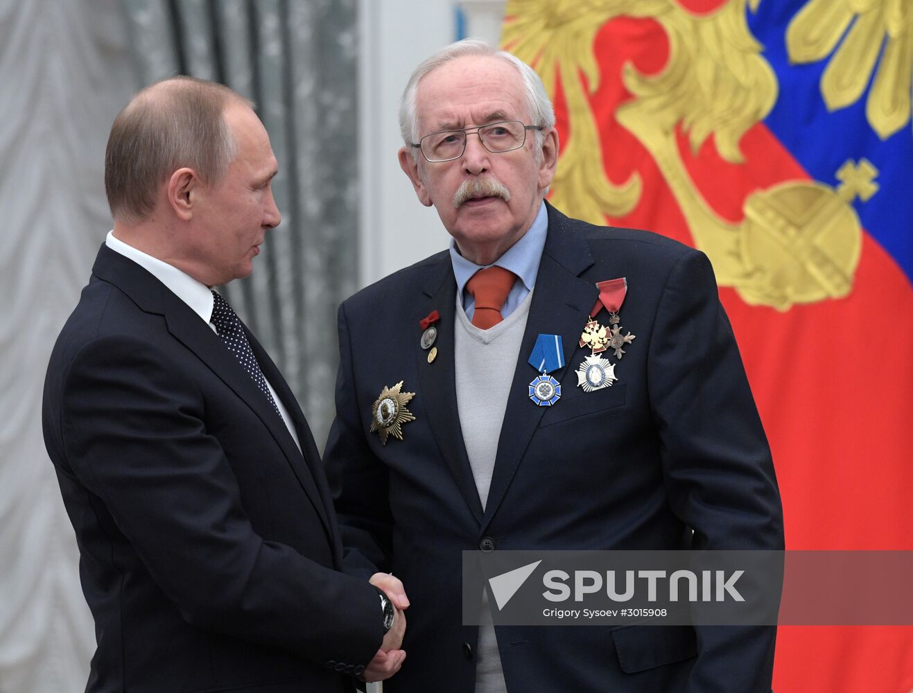 Russian President Vladimir Putin presents state decorations