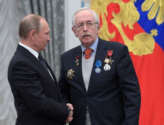 Russian President Vladimir Putin presents state decorations