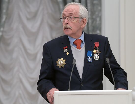 Russian President Vladimir Putin presents state decorations