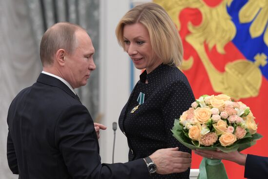 Russian President Vladimir Putin presents state decorations