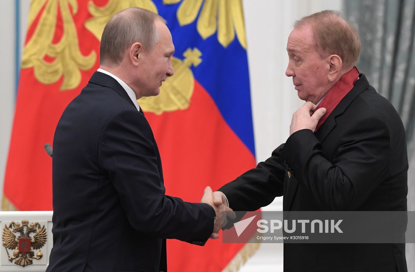 Russian President Vladimir Putin presents state decorations