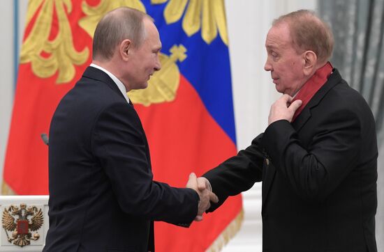 Russian President Vladimir Putin presents state decorations