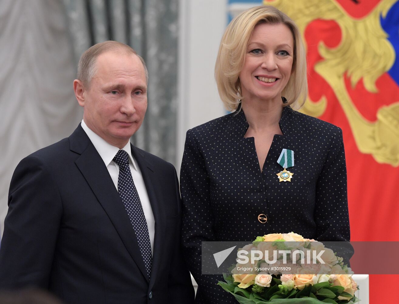 Russian President Vladimir Putin presents state decorations