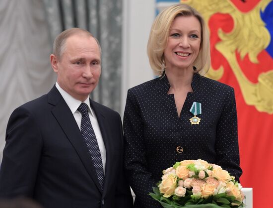Russian President Vladimir Putin presents state decorations