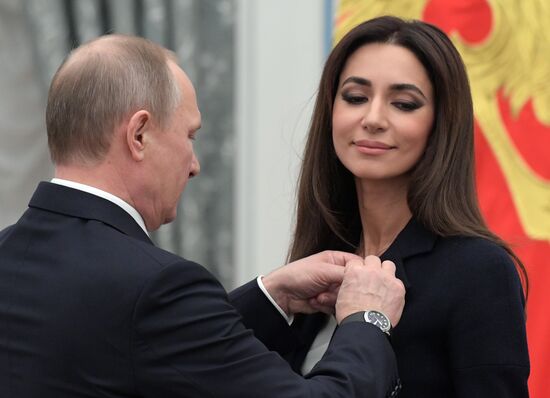 Russian President Vladimir Putin presents state decorations