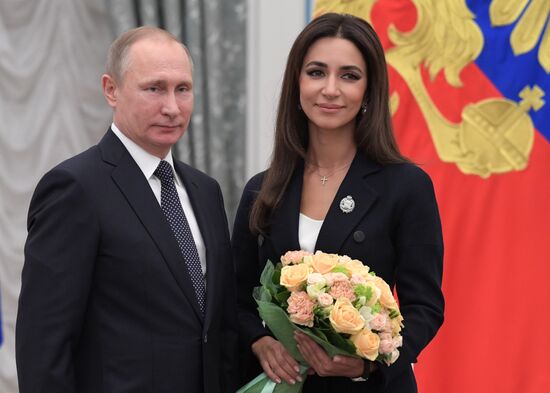 Russian President Vladimir Putin presents state decorations