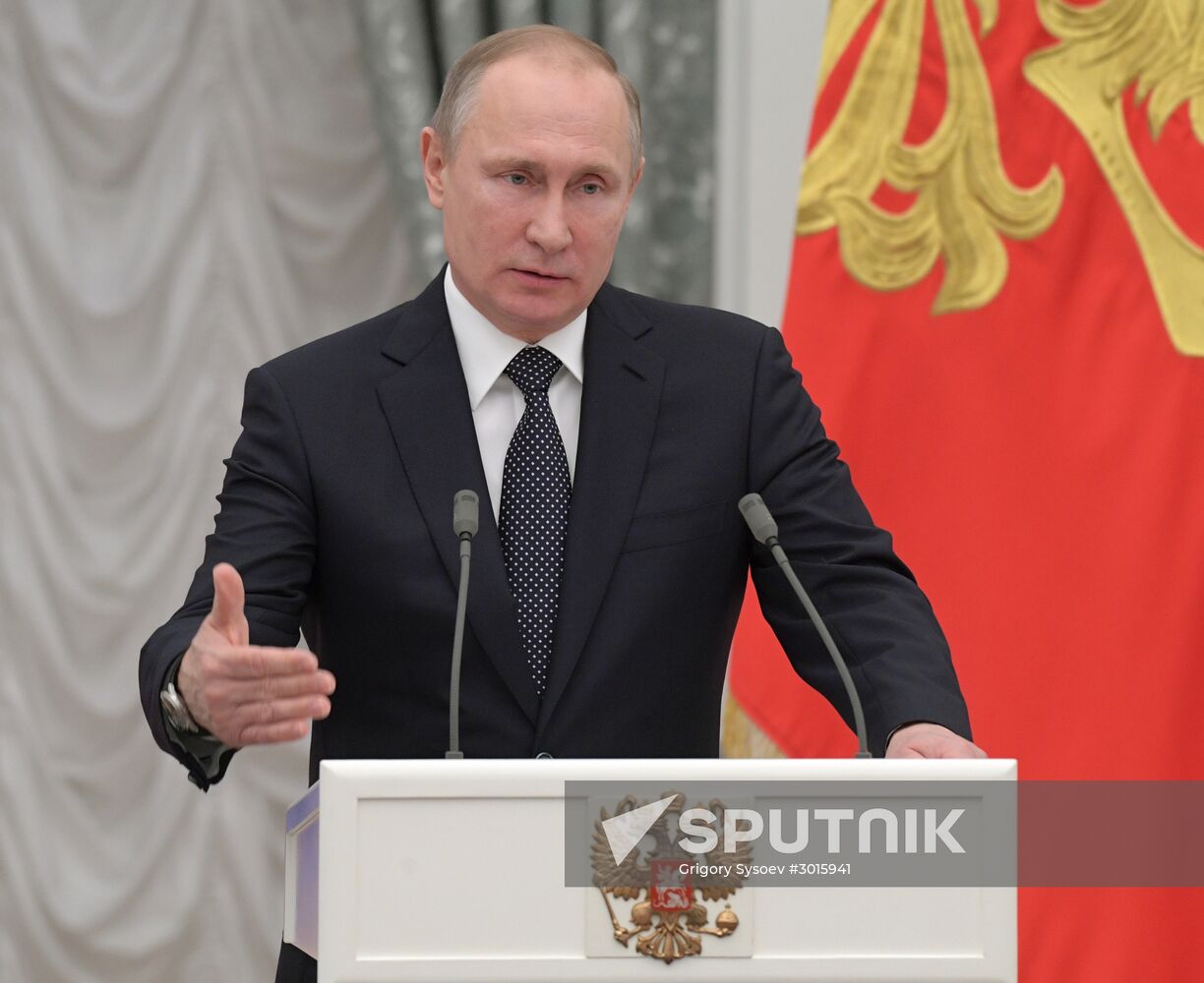 Russian President Vladimir Putin presents state decorations