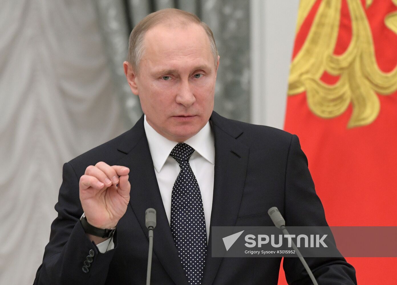 Russian President Vladimir Putin presents state decorations