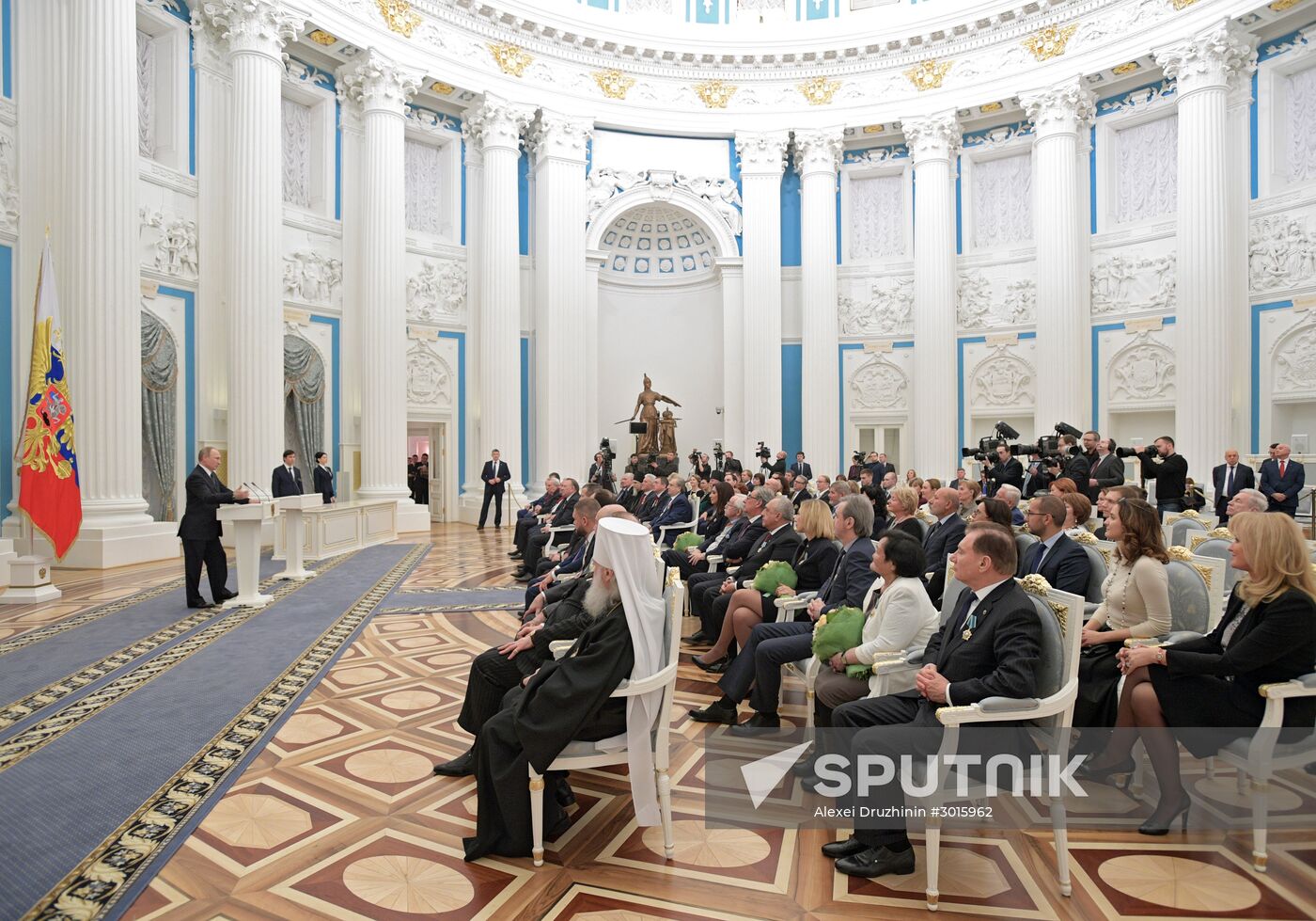 Russian President Vladimir Putin presents state decorations