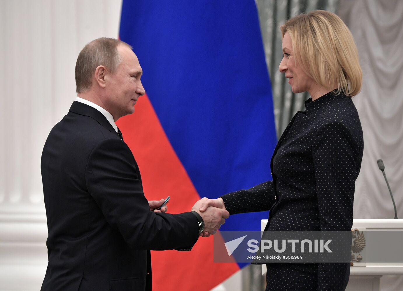 Russian President Vladimir Putin presents state decorations