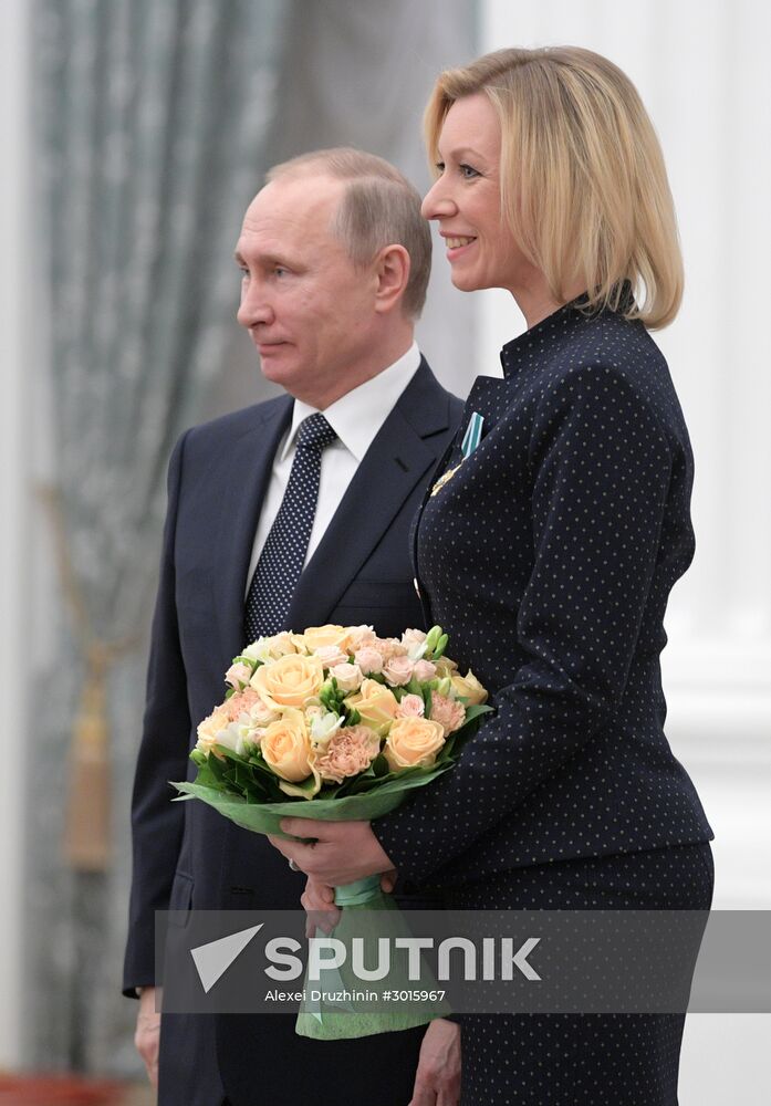 Russian President Vladimir Putin presents state decorations